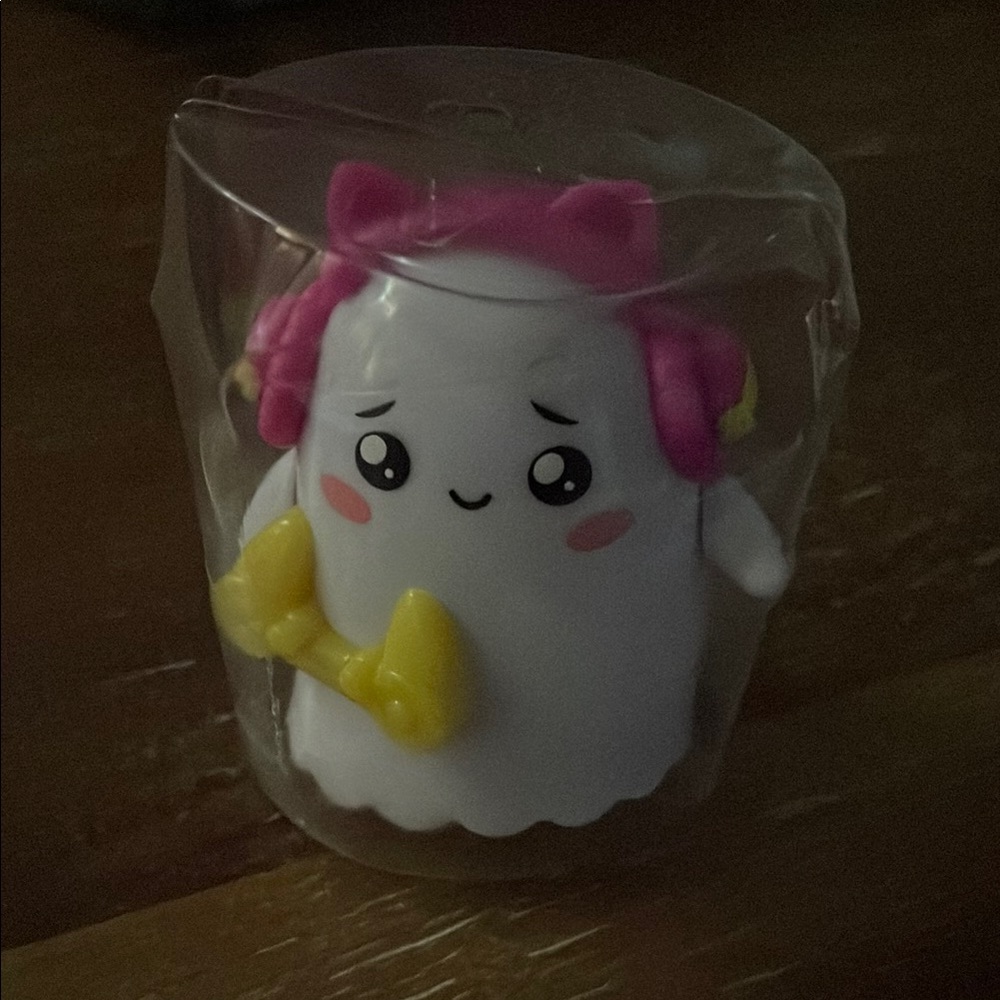 Cute Ghost Action Figure with Pink and Yellow Accents